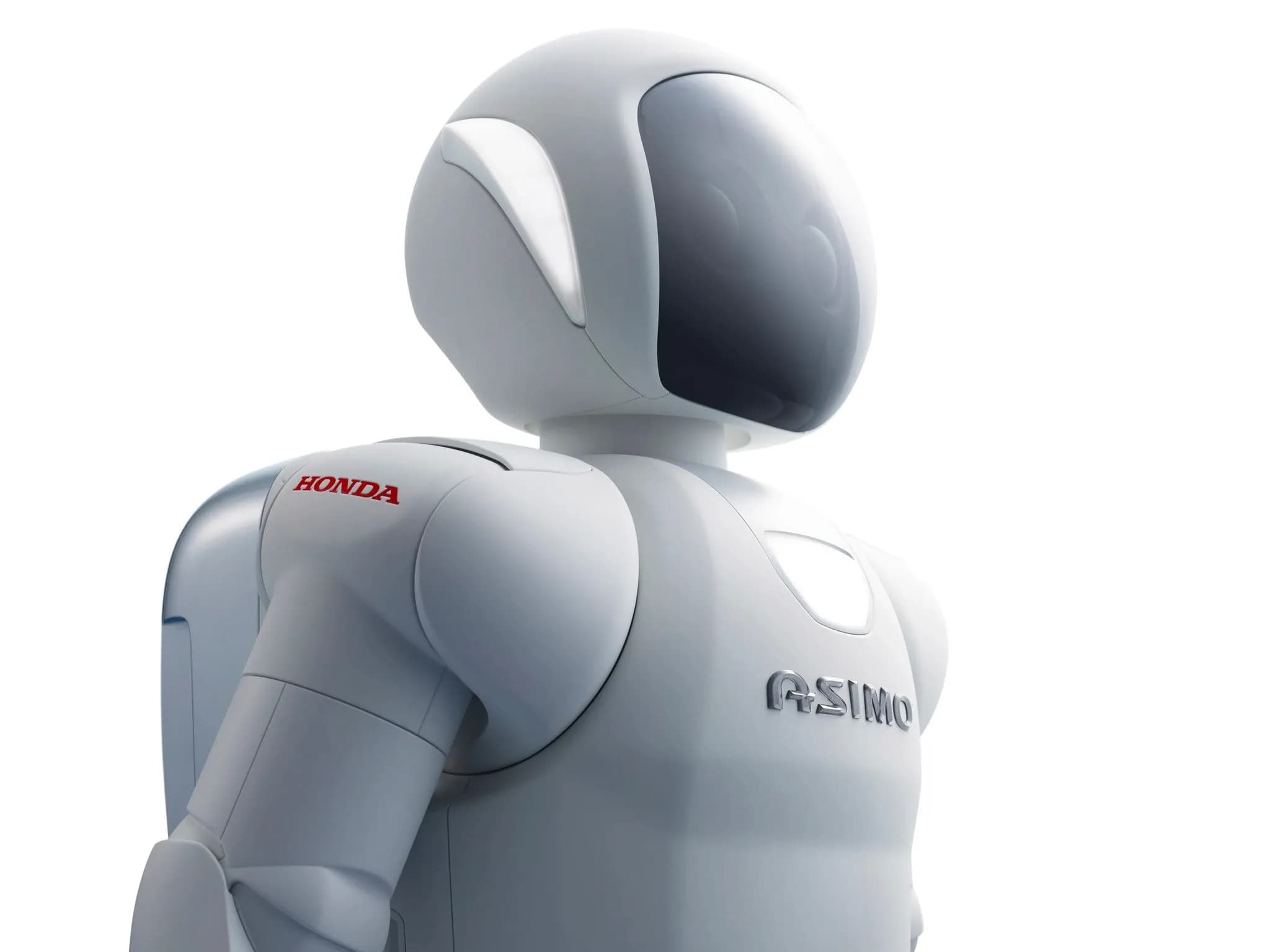 Крупный план ASIMO — белого робота с защитным щитком на лице и рюкзаком.